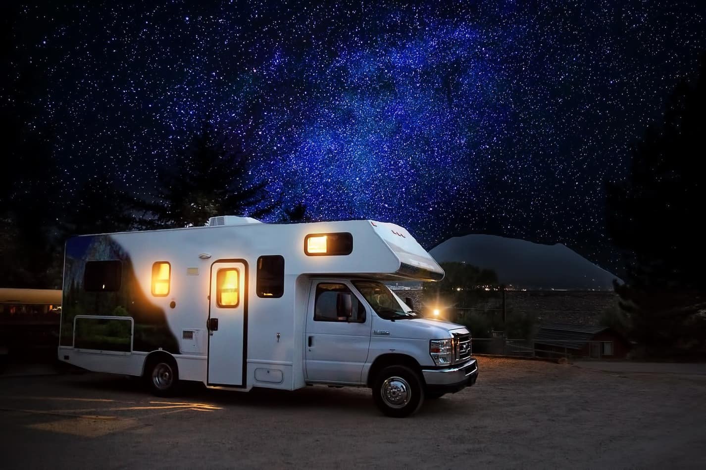 RV at nighttime with stars in background