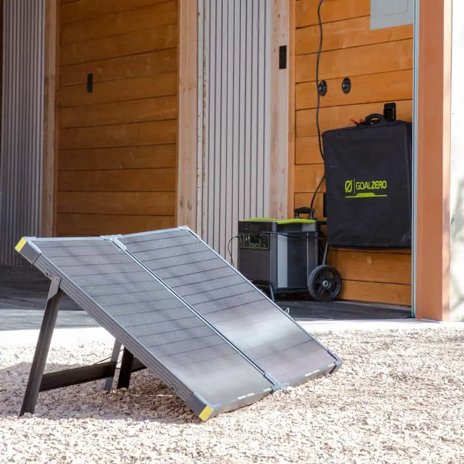 Boulder 100 foldable solar panel outside of garage