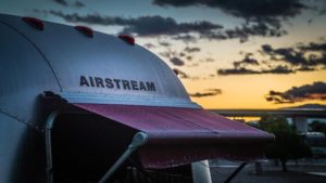 airstream with morning sun background